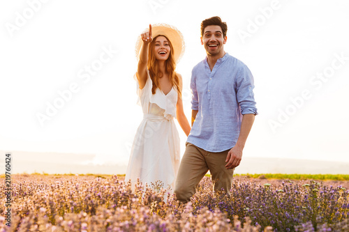 Lovely young couple embracing at the lavender field