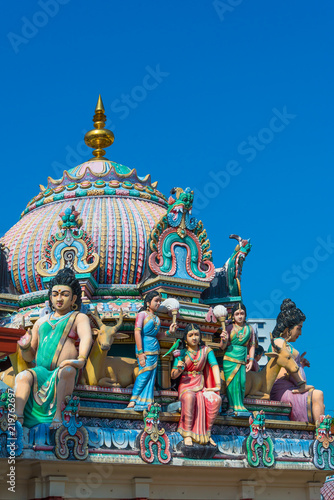 The colorful Statue of Sri Mariamman the oldest Hindu temple Chinatown travel destination in Singapore with blue sky © pomphotothailand