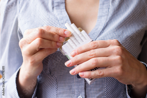 Cigarette addiction. Tobacco nicotine smoke. Shallow depth of field.