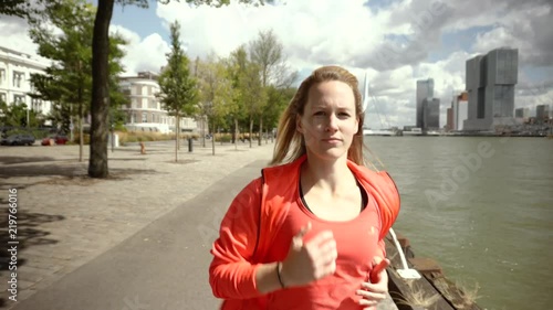Young girl jogging in the city dock, running, fitness