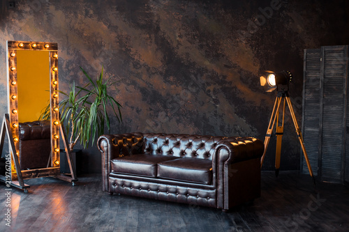 unusual loft interior. leather sofa. room in brown color. luxury livingroom
