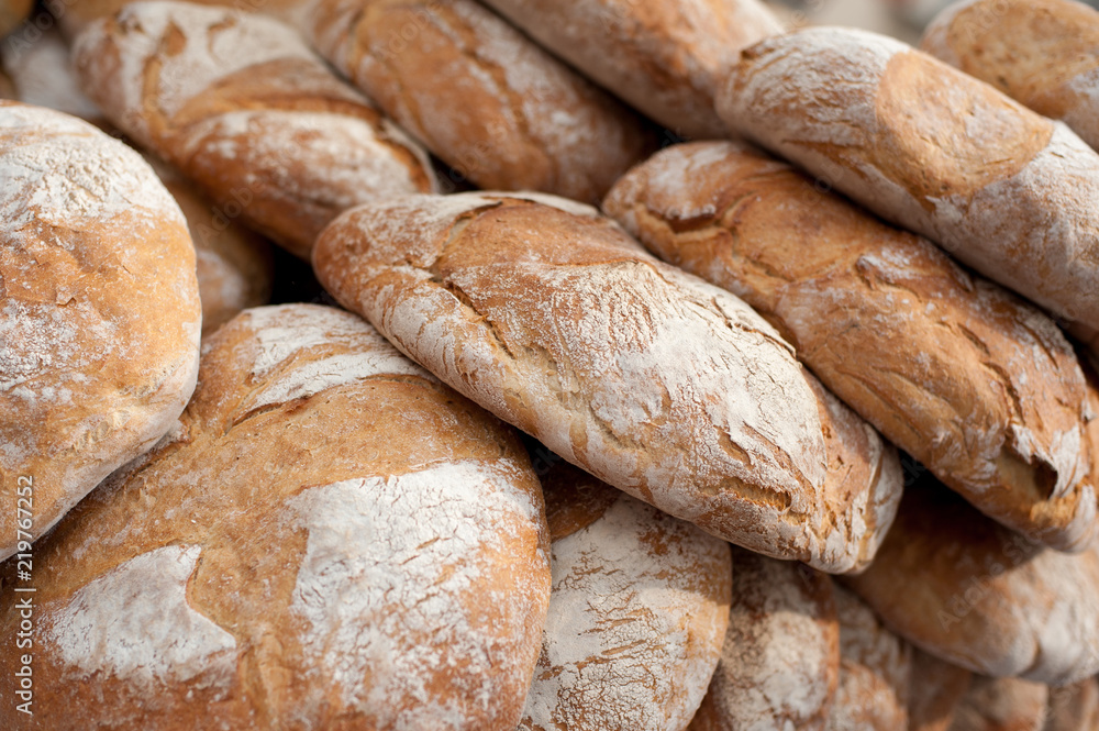 Freshly baked bread background. Appetizing, fragrant, traditional and delicious.