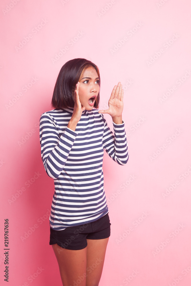 Young Asian woman is surprised and smile. Young Asian woman is surprised and smile.