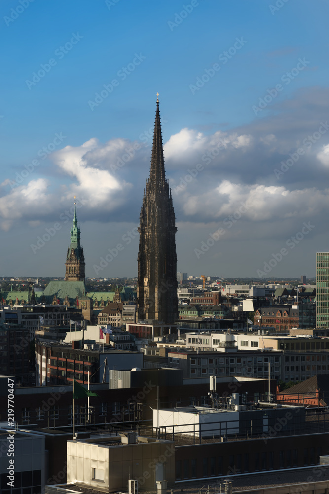 The Church of St. Nicholas in Hamburg, Germany against amazing cloudy sky