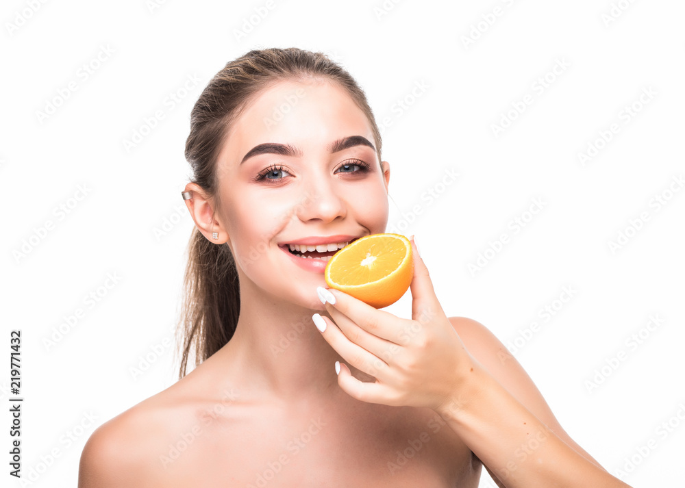 Close up beauty portrait of an excited attractive half naked woman holding orange slices at her face and looking at camera isolated over white background Close up beauty portrait of an excited attractive half naked woman holding orange slices at her face and looking at camera isolated over white background