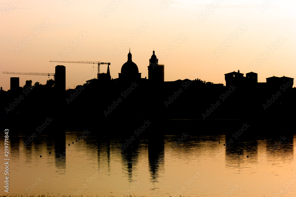 Silhouette of city skyline, evening light