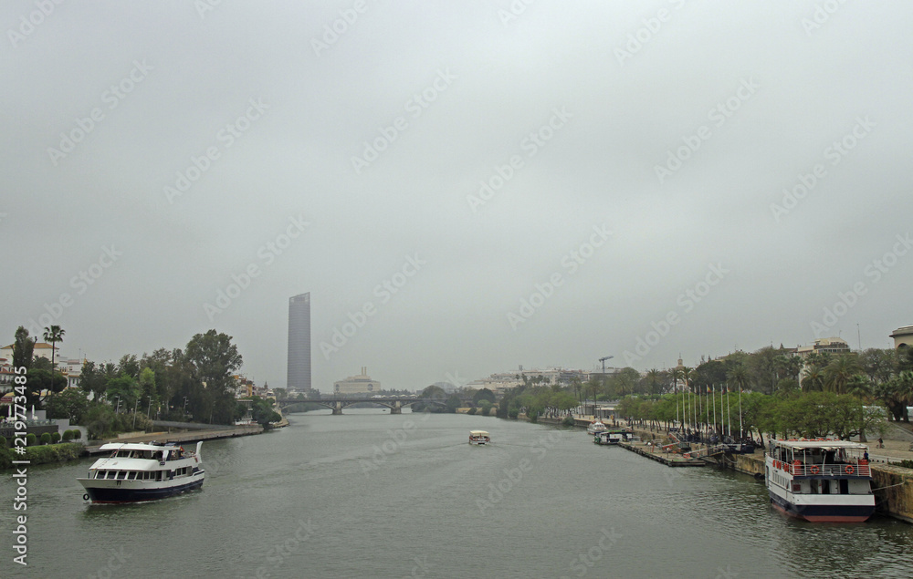 the cityscape with Guadalquivir river in Seville,