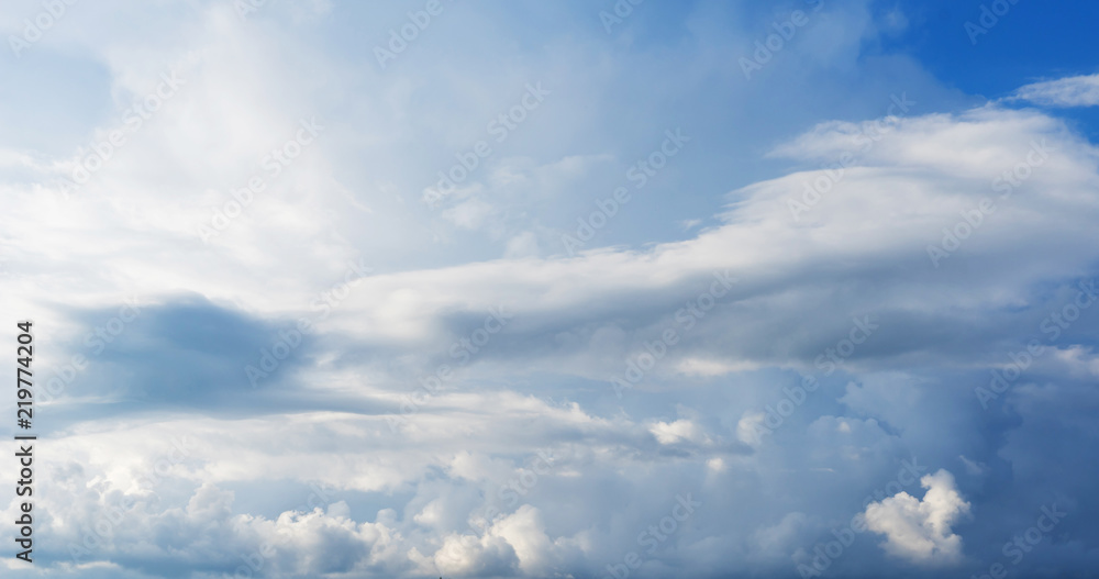 Blue sky background with clouds. Close up.