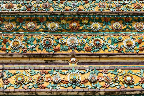 Close up beauitful mosaic tiles of large stupas in Wat Pho or Wat Phra Chetuphon Vimolmangklararm Rajwaramahaviharn is one of Bangkok's oldest temples photo