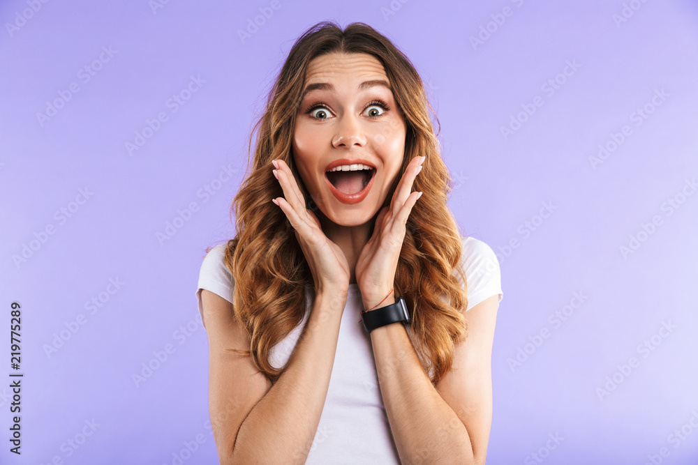 Screaming shocked woman isolated over purple wall background. Screaming shocked woman isolated over purple wall background.