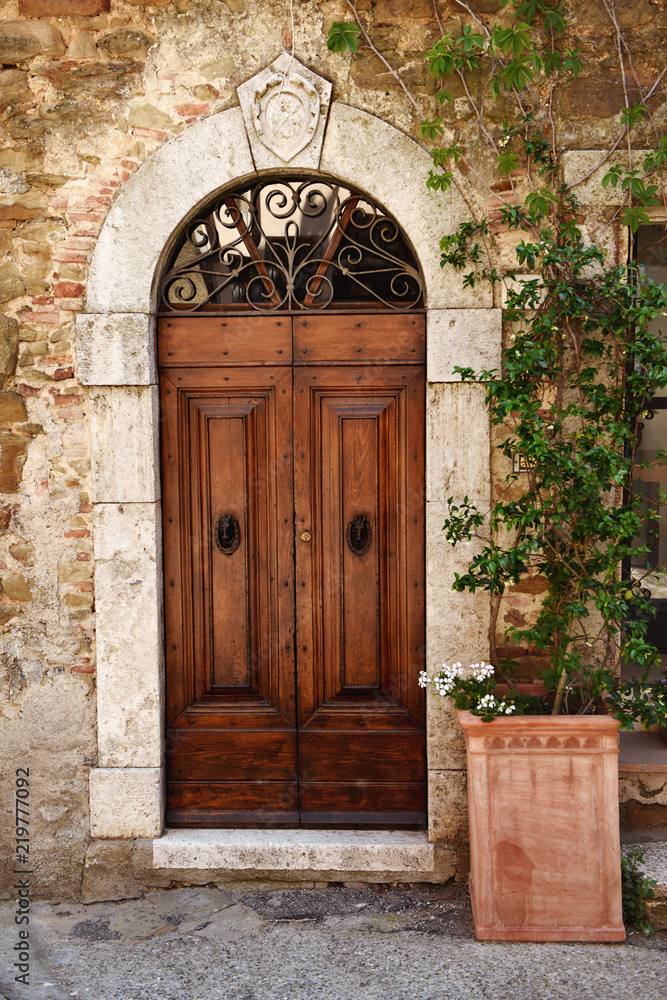 Old wooden door in Tuscany, Italy