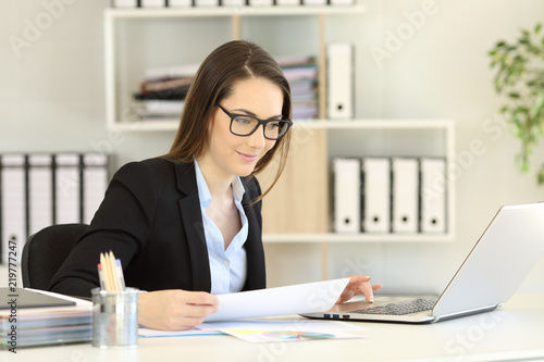 Office worker wearing eyeglasses working online