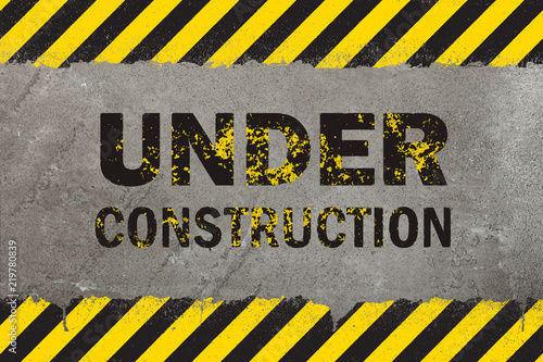 Concrete background with grunge hazard sign