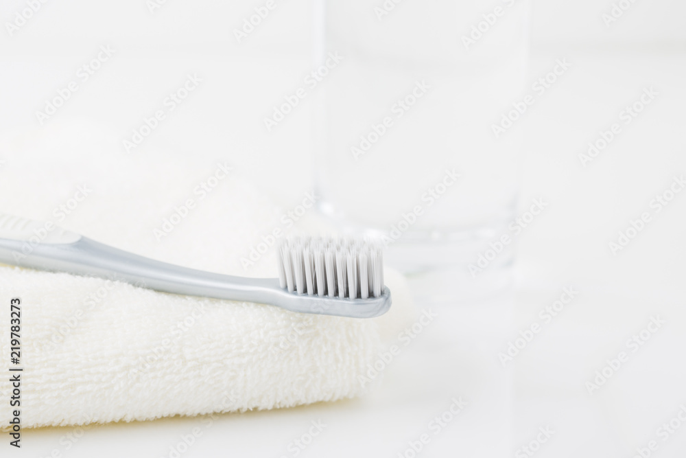 Clean toothbrush and a glass of water. Clean toothbrush and a glass of water.