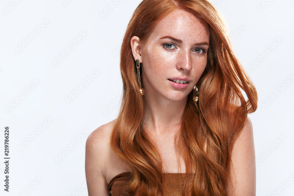 Red head girl with long and shiny wavy hair. Beauty. Beautiful model woman with curly ginger hairstyle and frackles. Red head girl with long and shiny wavy hair. Beauty. Beautiful model woman with curly ginger hairstyle and frackles.