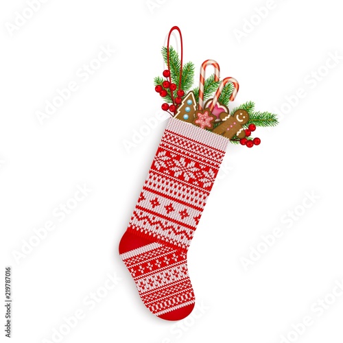 Christmas stocking with sweets and gifts in Scandinavian style isolated on white
