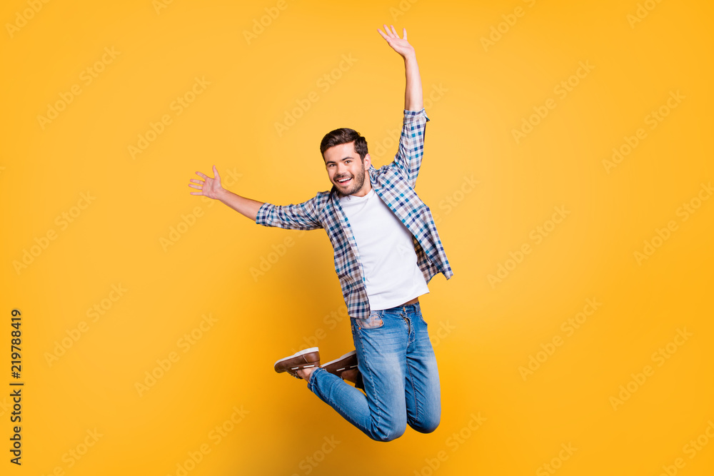 Full-size portrait of attractive well-dressed nice-looking man in jump isolated on shine yellow background - obrazy, fototapety, plakaty 