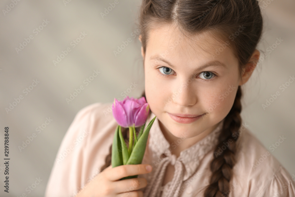 Cute little girl with beautiful flower