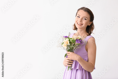 Beautiful woman with bouque...