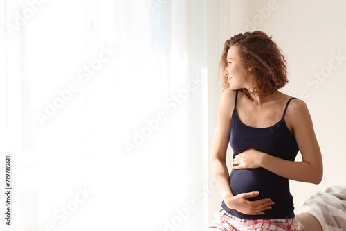 Morning of beautiful pregnant woman at home