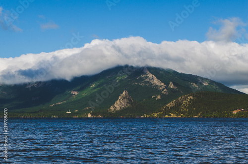 Beautiful landscape, lake, mountains in clouds and nature. © freeman83