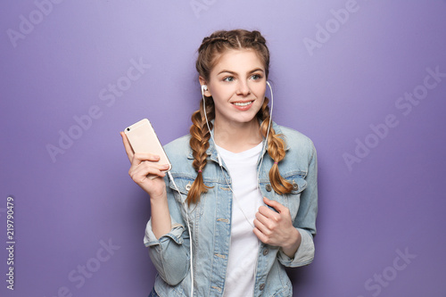 Beautiful young woman liste...