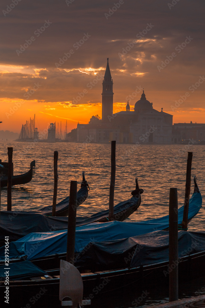 Morning in Venice. Gondolas at the pier. Italy