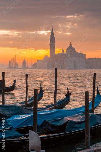 Morning in Venice. Gondolas at the pier. Italy