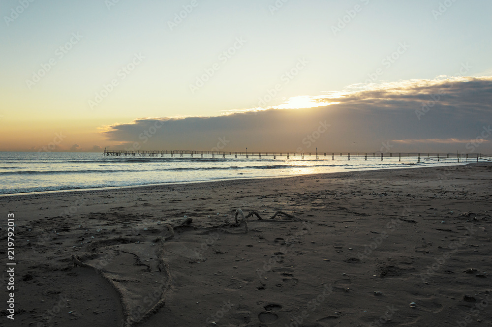 Sandy beaches of Rimini shortly after dawn in winter