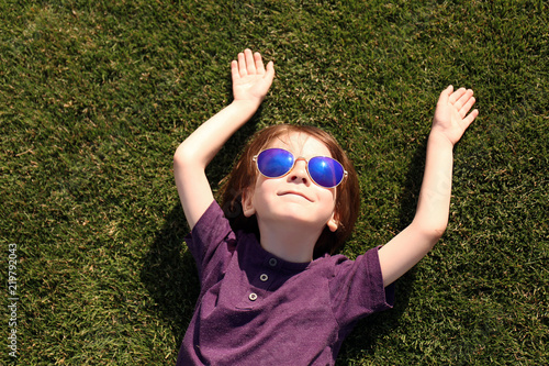 Cute little boy relaxing in...