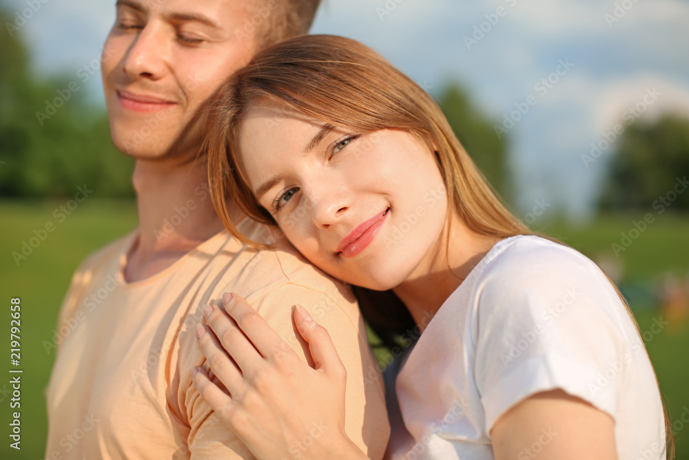 Happy young couple on sunny summer day