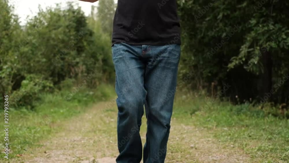 Close up shot of senior man skipping fancily with a jump rope on fresh air Close up shot of senior man skipping fancily with a jump rope on fresh air