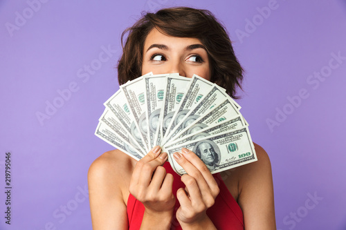 Cuadro en lienzo Happy Pretty brunette woman covering her face with money