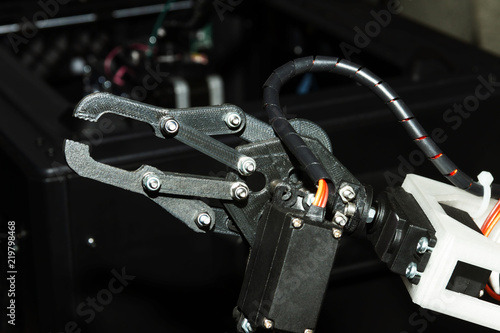 Industrial production robot hand as example of automatization in manufacturing in heavy industry © Monstar Studio