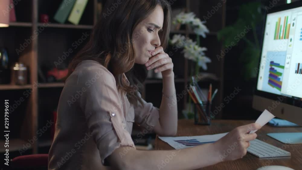 Frustrated business woman working on computer with economic data in home office. Upset woman manager leaning back on chair. Business crisis concept. Female boss thinking business solution Frustrated business woman working on computer with economic data in home office. Upset woman manager leaning back on chair. Business crisis concept. Female boss thinking business solution