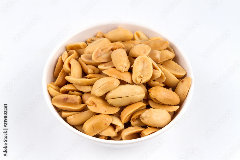 Peeled salted peanuts on white background Peeled salted peanuts on white background