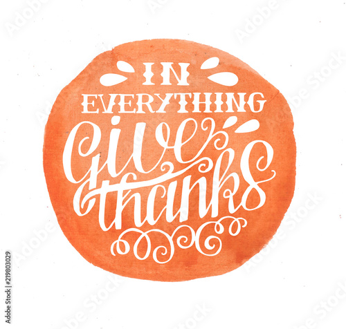 Hand lettering In everything give thanks on orange background photo