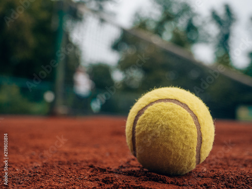 playing tennis on clay court © SmallWorldProduction