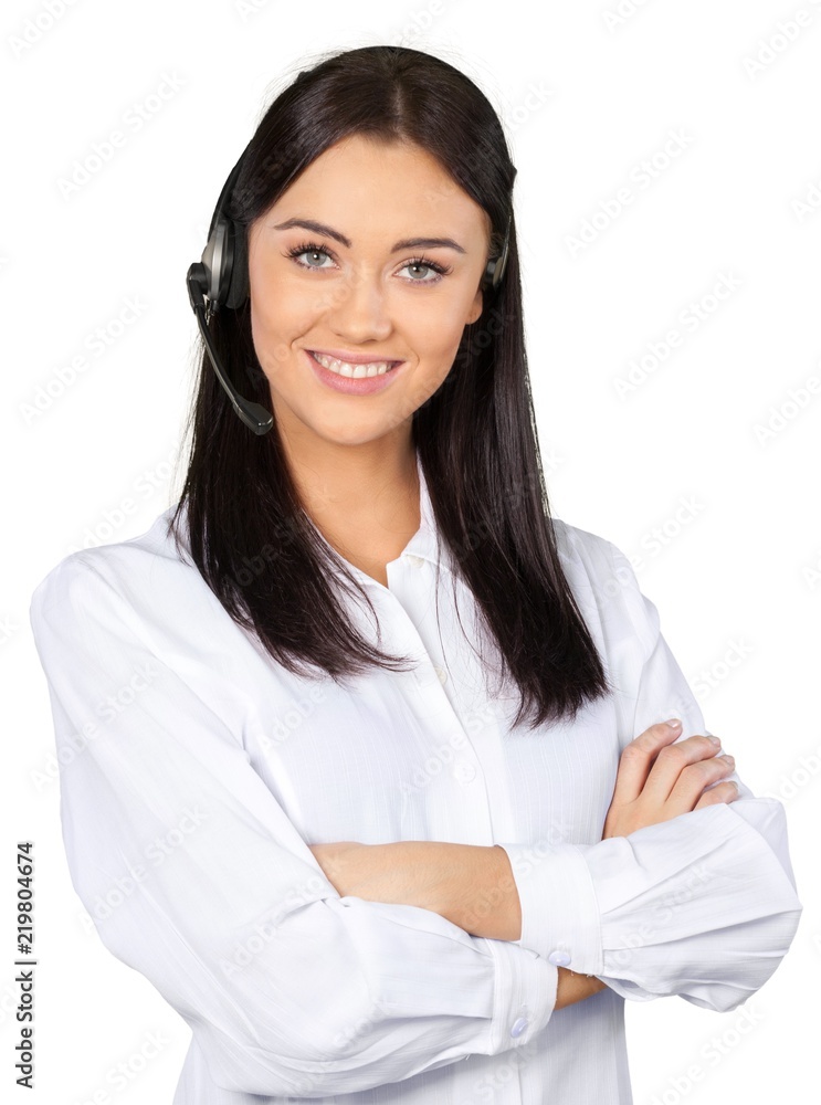 Young Woman with Arms Folded Talking on Headset - Isolated Young Woman with Arms Folded Talking on Headset - Isolated