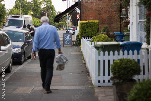 City street: cafe, people, cars, buildings, trees. English life style.