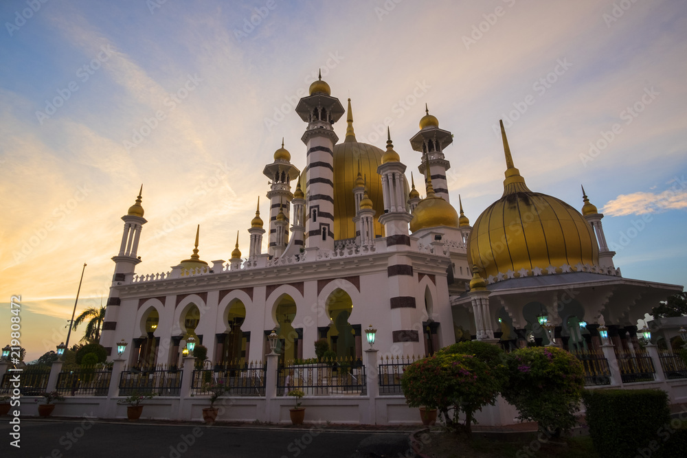 Beautiful Sunset Scenery at Royal Mosque Kuala Kangsar,Malaysia in Sillhoutte.Soft Focus,Blur due to Long Exposure.Visible Noise due to High ISO.