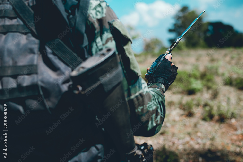 Soldiers are using the radio. And use the map For communication between military operations in the border forest. Guardian Soldiers are using the radio. And use the map For communication between military operations in the border forest. Guardian