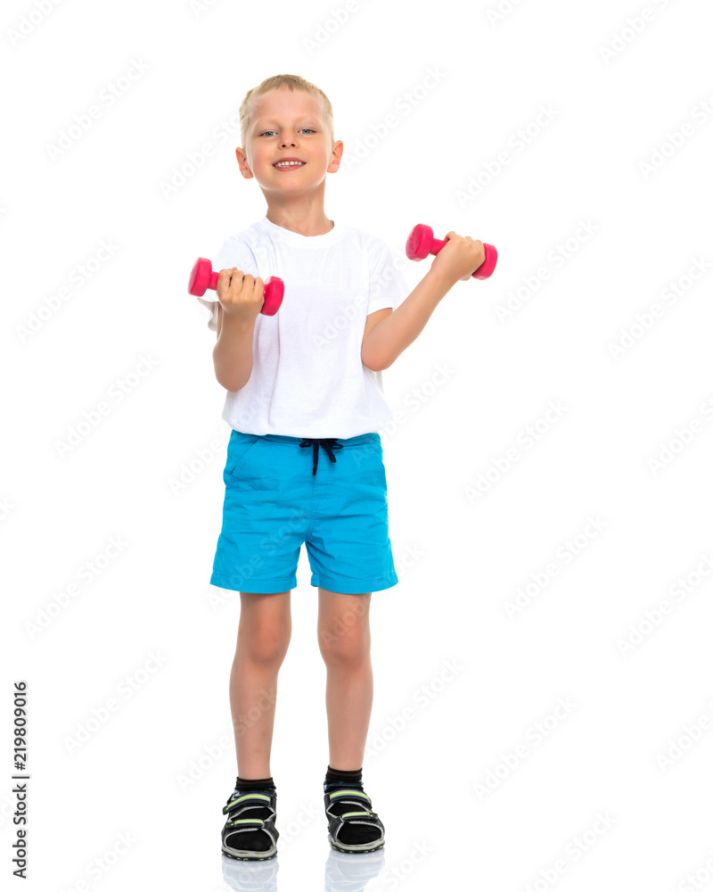 A little boy is lifting dumbbells. A little boy is lifting dumbbells.