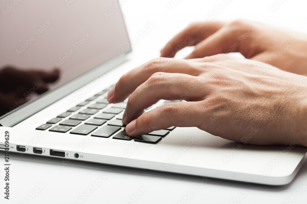 Closeup of a Man Typing on a Laptop Closeup of a Man Typing on a Laptop