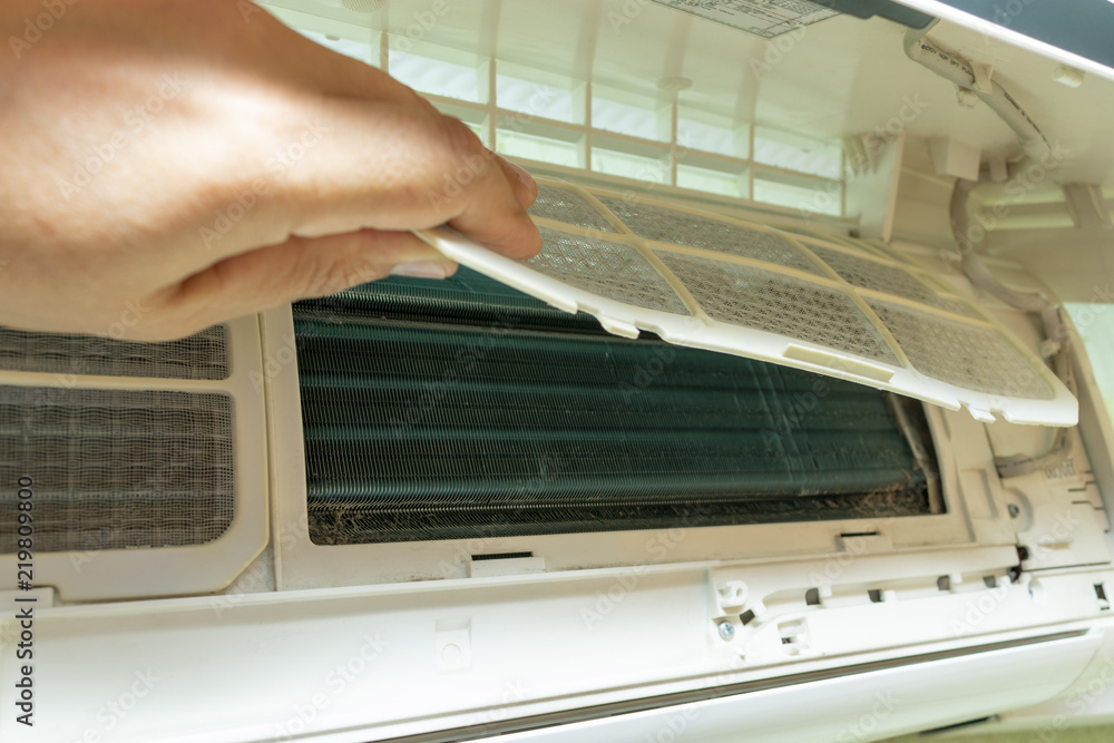 Fototapeta premium Disassembly of the air conditioner for cleaning from accumulated dust in the dust