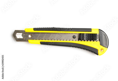 Yellow paper cutter isolated on white photo