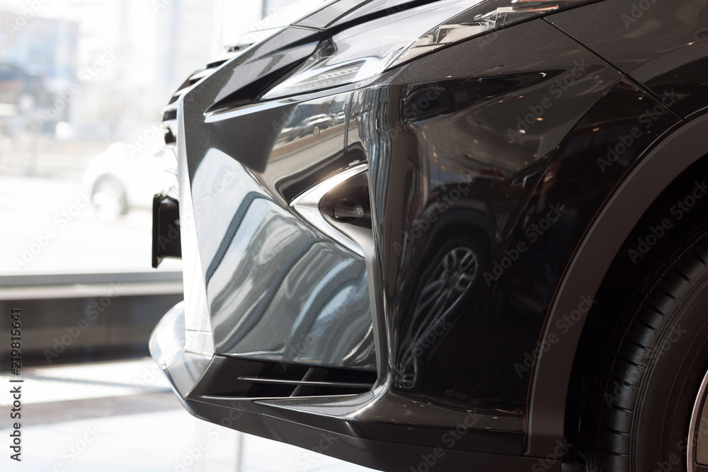 New vehicle with elegant head lamps. Side view. New vehicle with elegant head lamps. Side view.
