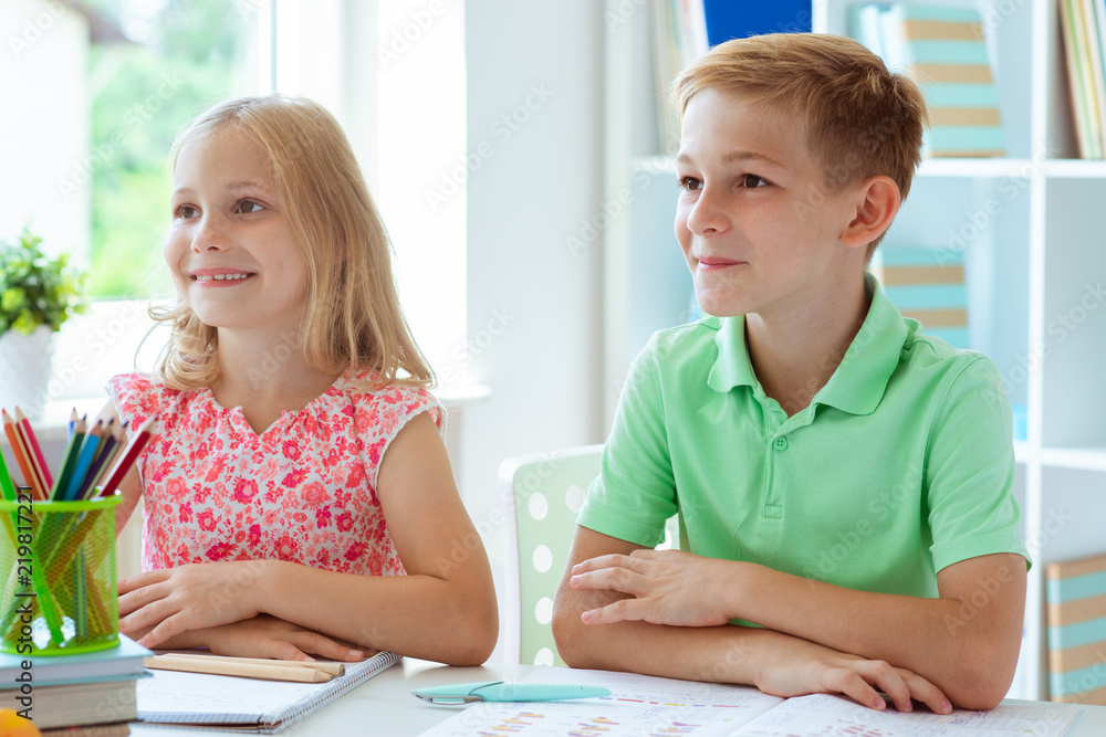 Schoolchildren are came back to school and learning at the table in classroom Schoolchildren are came back to school and learning at the table in classroom