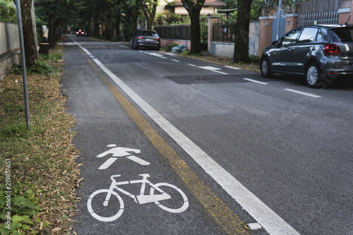 Bicycle road sign painted on sidewalk
