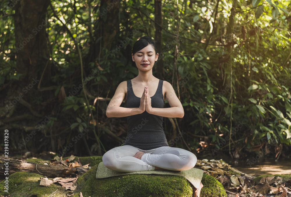 Young woman meditating in yoga. Young woman meditating in yoga.